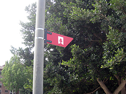 A small arrow, showing only the logo, positioned on street lights on built-up stretches of the route