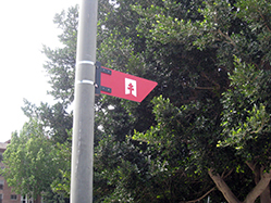 A small arrow, showing only the logo, positioned on street lights on built-up stretches of the route A small arrow, showing only the logo, positioned on street lights on built-up stretches of the route