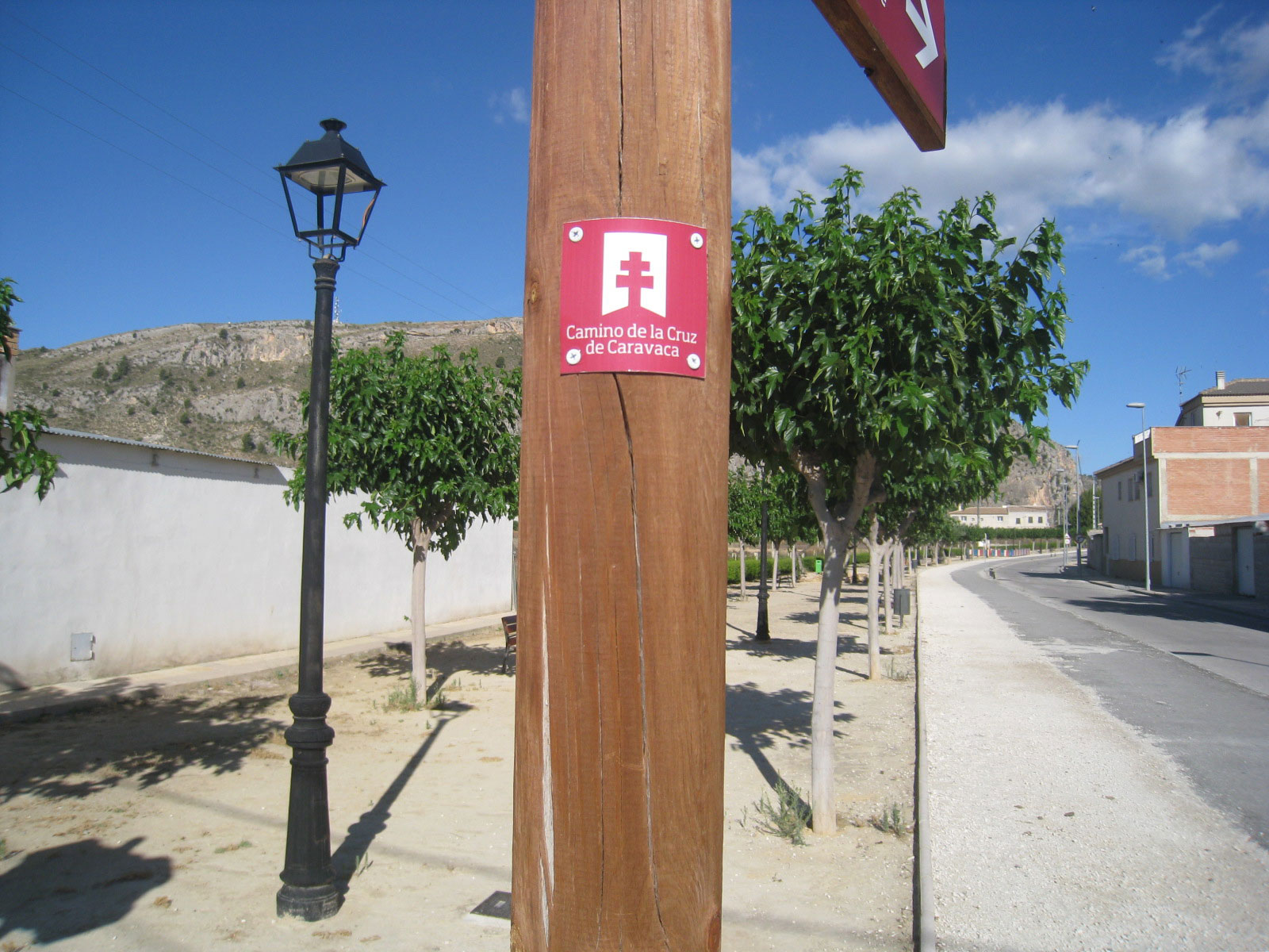 Small plate screwed to a wooden post